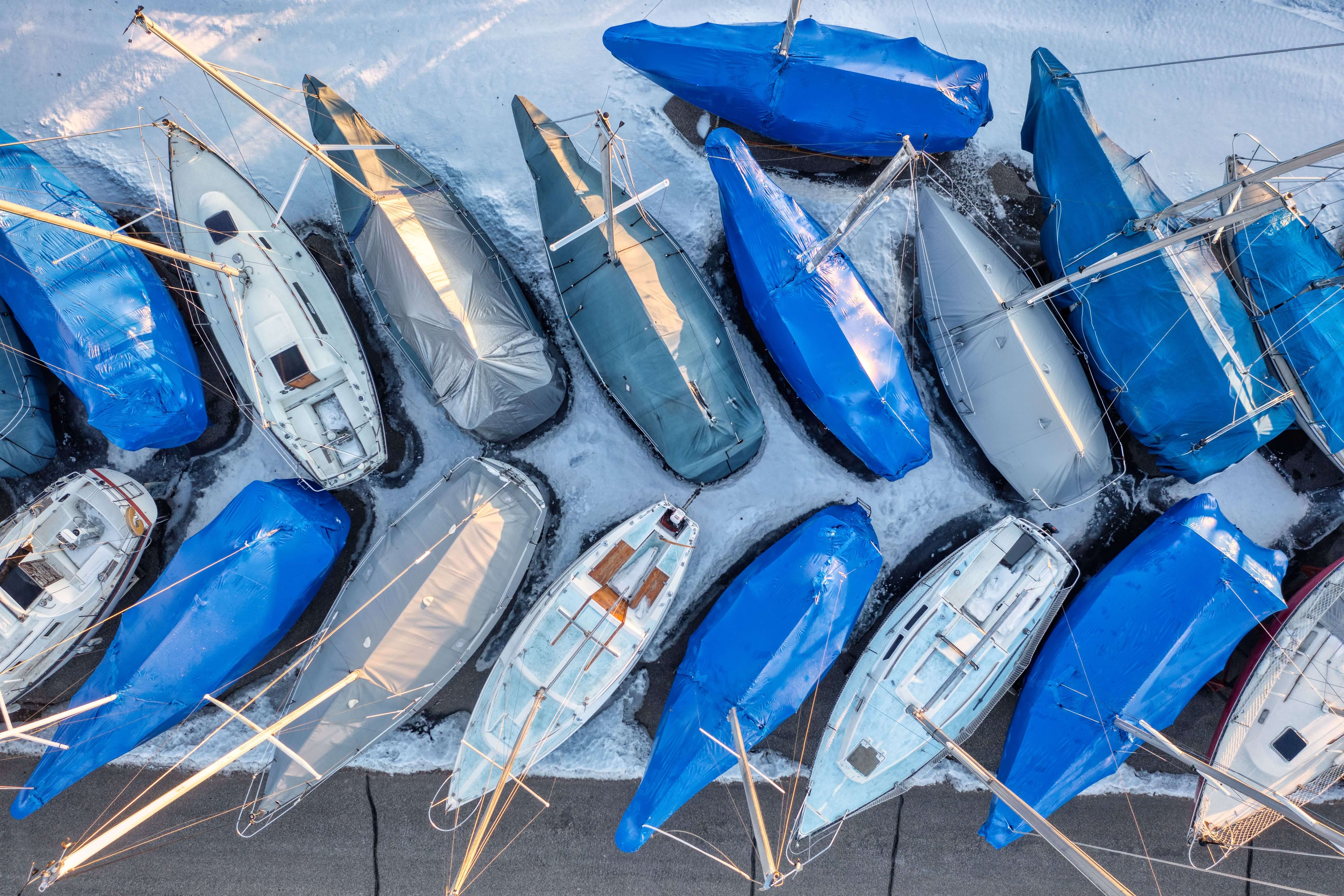 Boats shrink-wrapped for winter storage in the Great Lakes